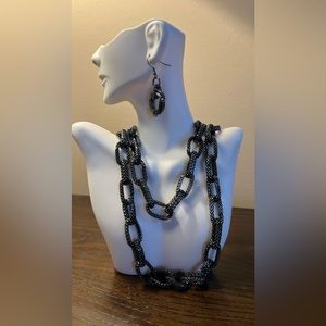 Gunmetal long chain that can be worn long or 2 layers faltering to neckline